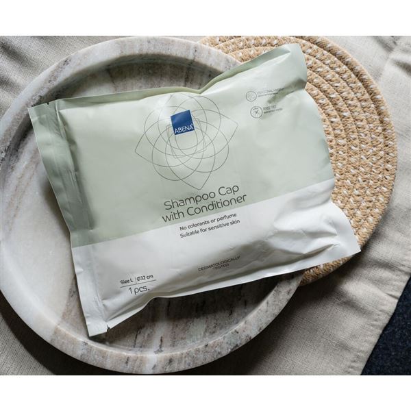 Abena mycí čepice se šamponem a kondicionerem